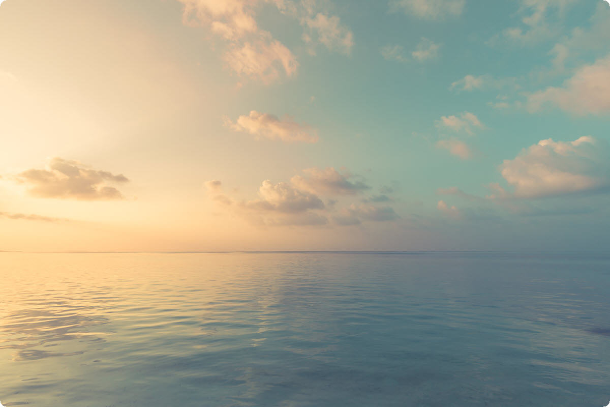 Calm ocean meeting a soft horizon under a peaceful sky Calm ocean meeting a soft horizon under a peaceful sky