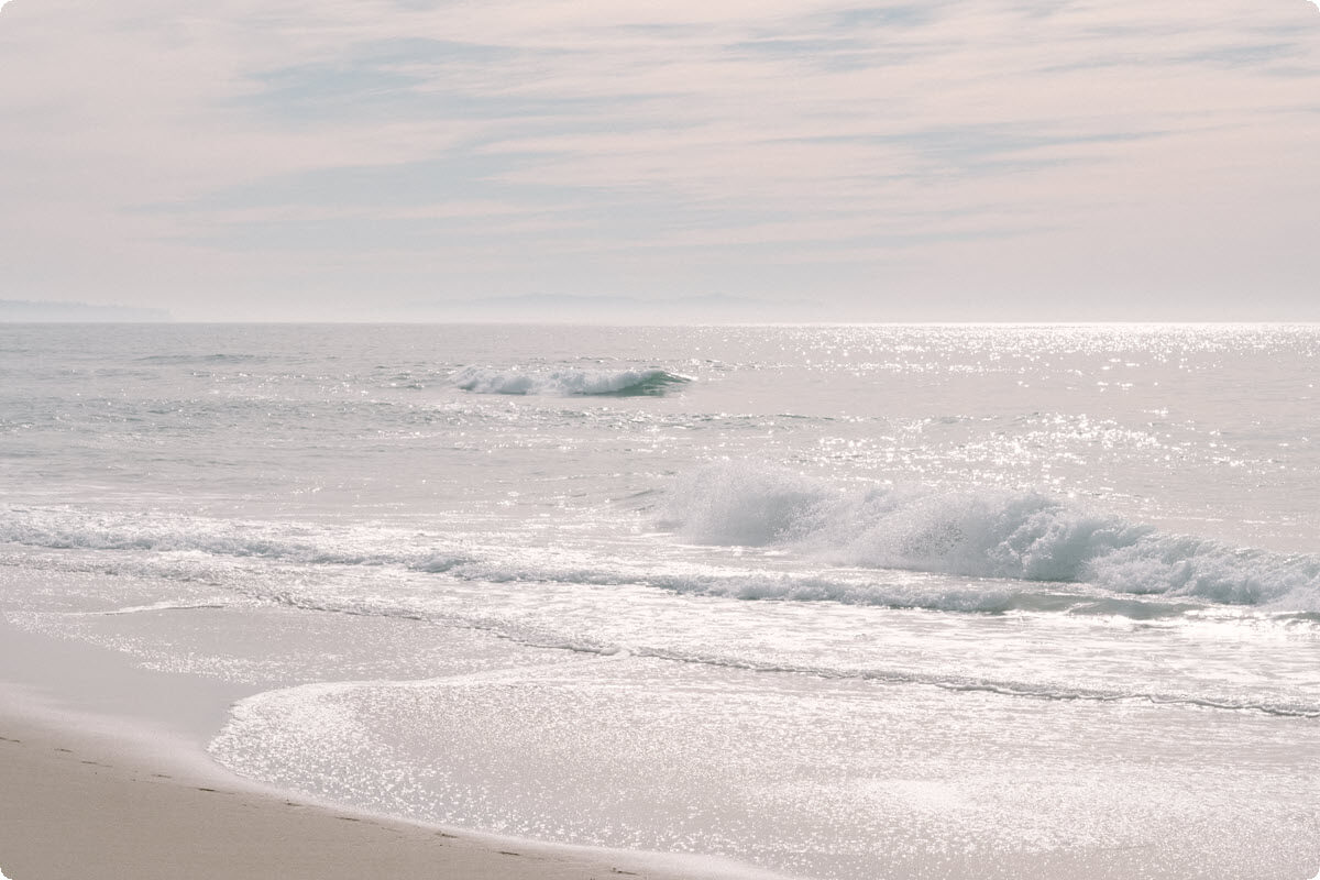 Gentle ocean waves rolling softly along the shore Gentle ocean waves rolling softly along the shore